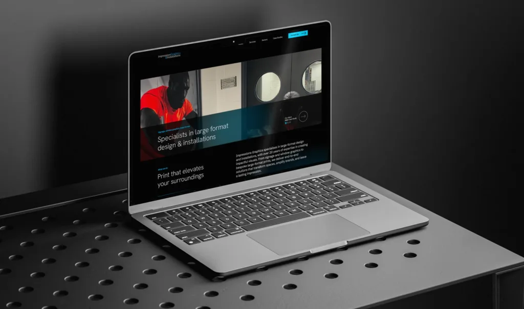 Impression Graphics Website Design on a laptop