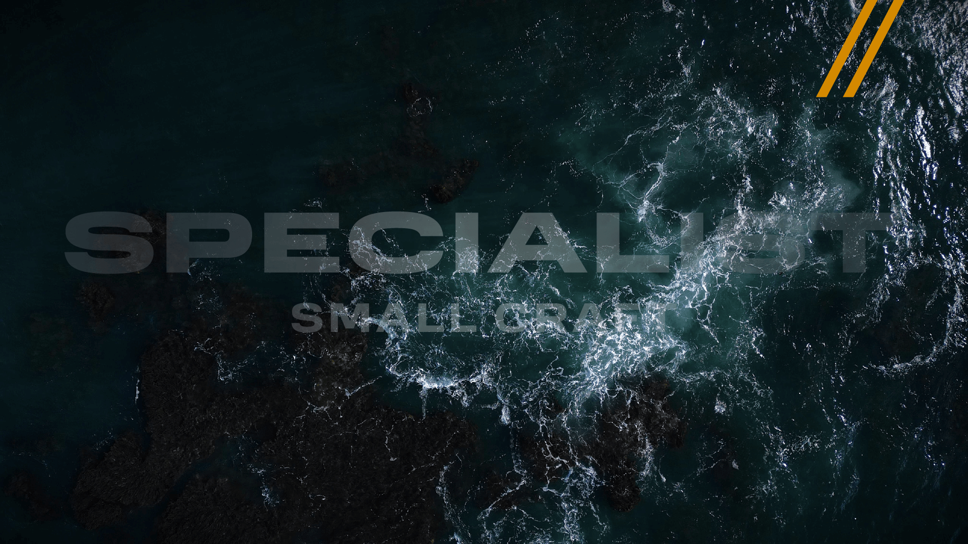 Aerial view of waves breaking with Specialist Small Craft logo overlay